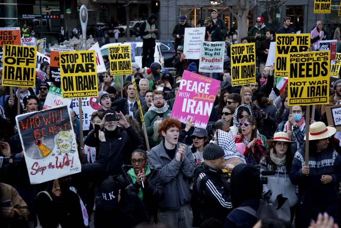 People attending the “Stop the War on Iran” protest in Times Square, New York, after the US and Israel launched the first attack on Iran, killing over 200 people on February 28th. c/o USA Today